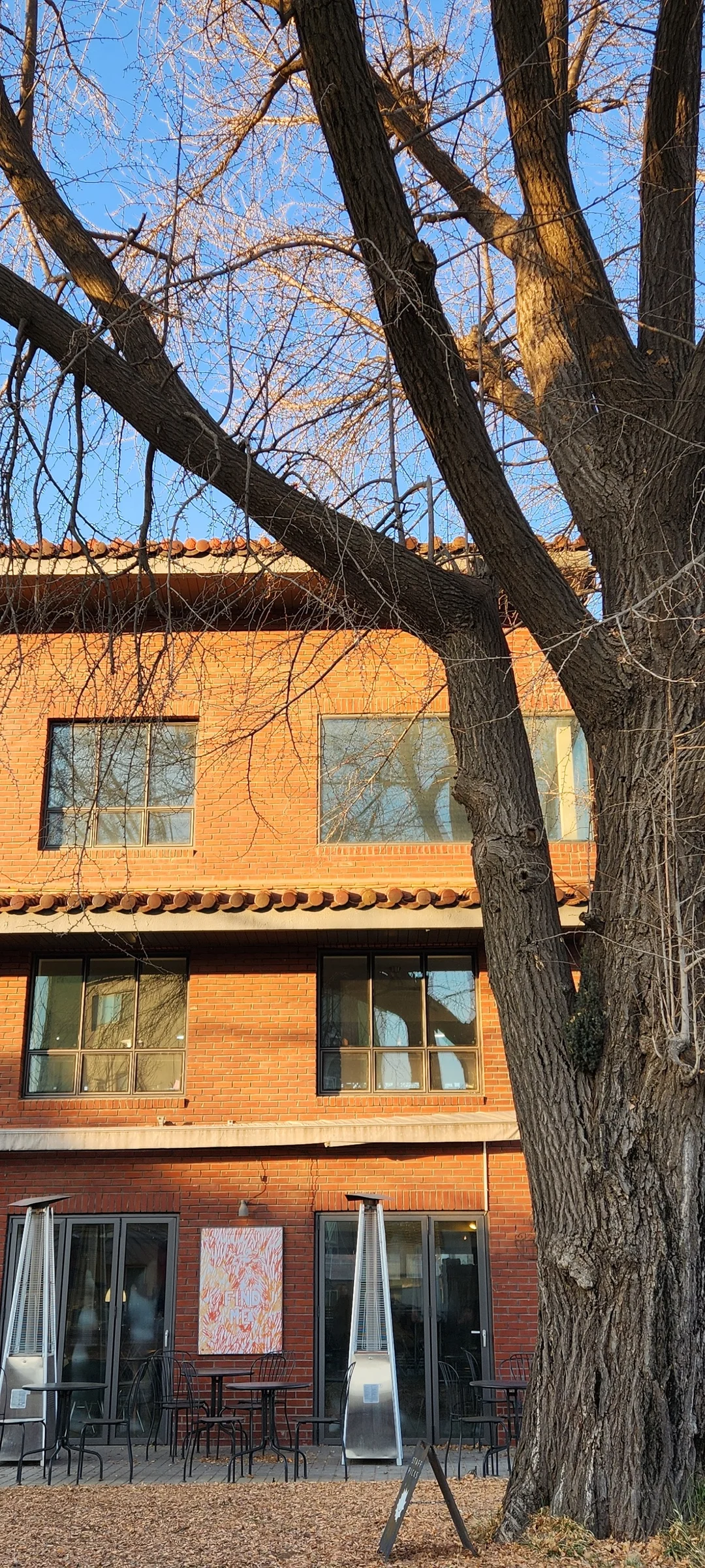 Experience the vibrant pulse of Korean city life through these dynamic street wallpapers. Bustling crosswalks in Myeongdong, colorful shop fronts in Hongdae, rain-slicked sidewalks reflecting neon signs, and everyday moments of commuters, street vendors, and cyclists moving through Seoul's urban rhythm — each image tells a story of a city constantly in motion.

Beyond Seoul, you'll find the charming streetscapes of Busan's hillside neighborhoods, the retro storefronts of Jeonju, and quiet residential lanes where laundry dries on balconies above parked scooters. These free Korean street wallpapers are perfect as an aesthetic phone background for anyone captivated by the raw energy and visual richness of Korean urban culture., Pirundae-ro 1-gil, Sajik-dong, Seoul — Free Korean aesthetic wallpaper