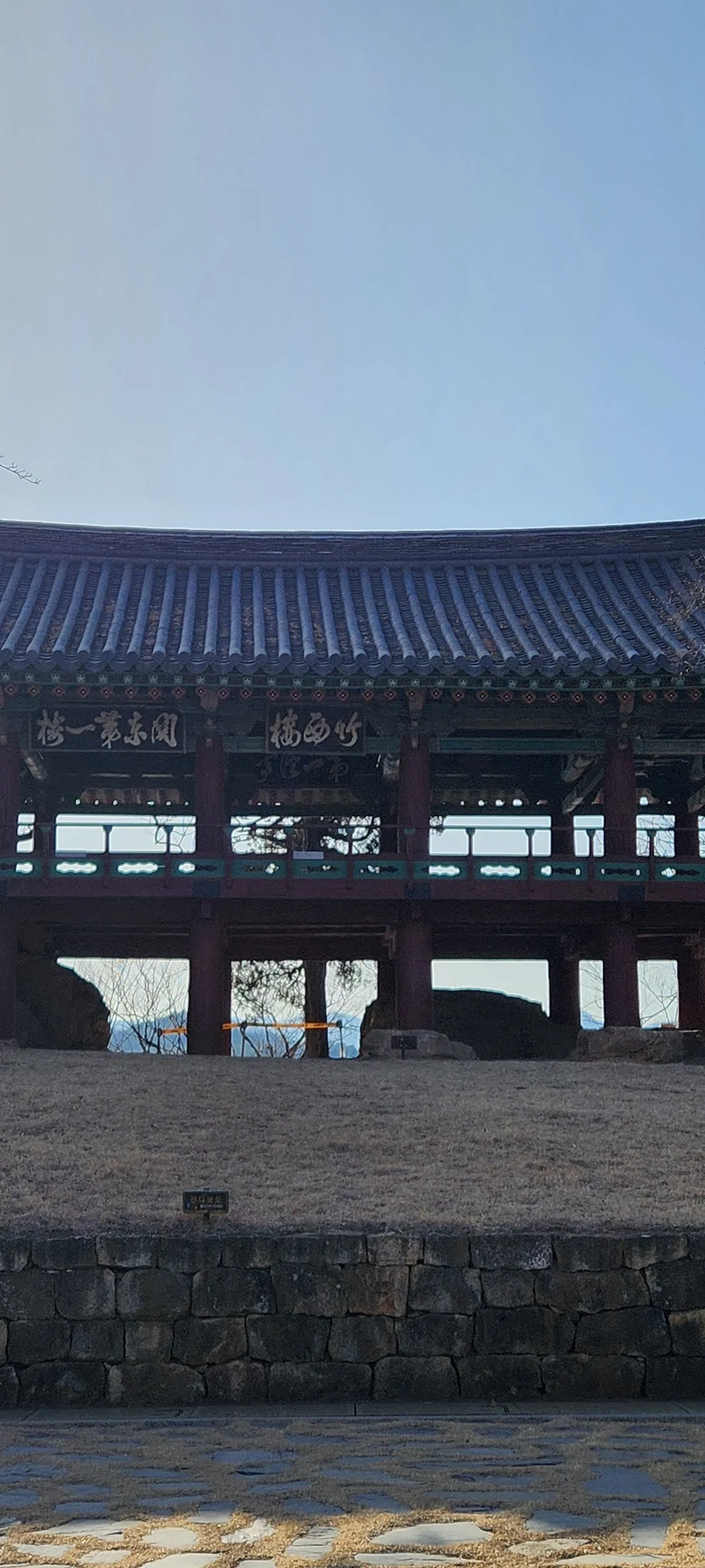 Explore Korea's architectural landscape through stunning phone wallpapers that span centuries of design. From the sleek glass curtain walls of Gangnam's skyscrapers to the raw concrete forms of brutalist apartment complexes, these images capture how Korea blends cutting-edge modernity with bold structural expression.

Look closer and you'll discover geometric patterns in subway station ceilings, sweeping curves of the Dongdaemun Design Plaza, and the quiet symmetry of traditional gate structures standing beside high-rises. Whether you're drawn to minimalist Korean design or dramatic urban geometry, these free aesthetic wallpapers transform your phone background into a gallery of architectural photography., Jukseoru-gil, Seongnae-dong, Samcheok-si — Free Korean aesthetic wallpaper